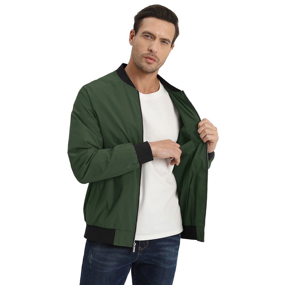 Man demonstrating the inner fit of an army green TACVASEN lightweight bomber jacket