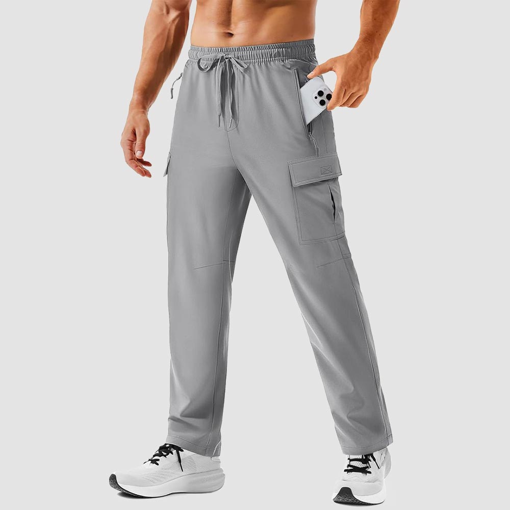 TACVASEN hiking pants on a snowy trail with reinforced knees